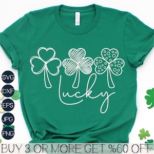 May include: A green t-shirt with a white design of three shamrocks and the word "lucky" written in a cursive font.