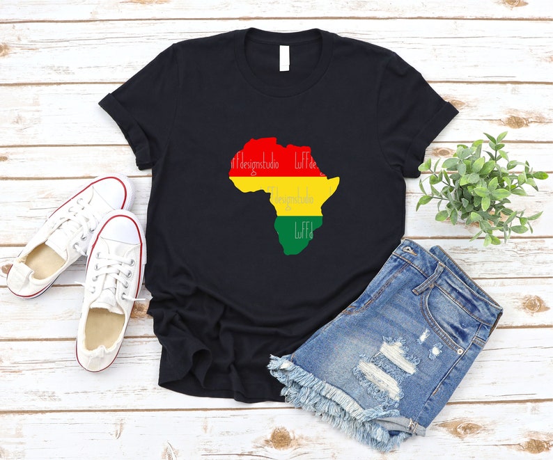 May include: Black t-shirt with a red, yellow, and green outline of the continent of Africa. The words "Designstudio Liff" are written in white inside the outline.