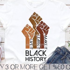 May include: A white t-shirt with a graphic design of three raised fists with the text "Make it Learn it Live it Black History" printed on the front. The text is in black and the fists are in shades of brown.