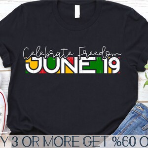May include: Black t-shirt with the text "Celebrate Freedom" and "JUNE 19" in colourful block letters. The text is in a white outline with red, yellow, and green fill.