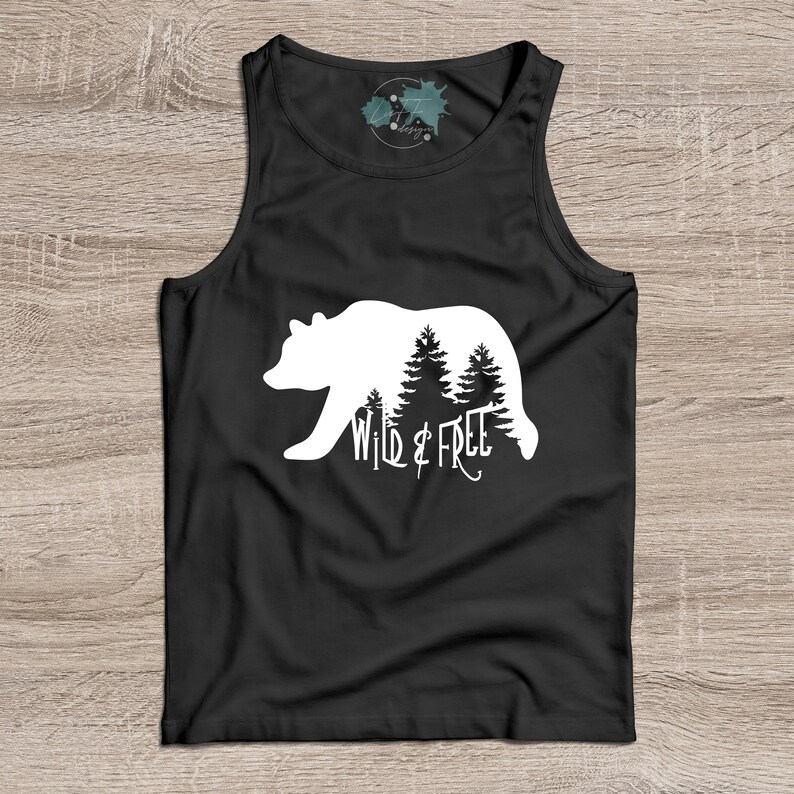 May include: Black tank top with a white silhouette of a bear walking through a forest with the text "Wild & Free" underneath.