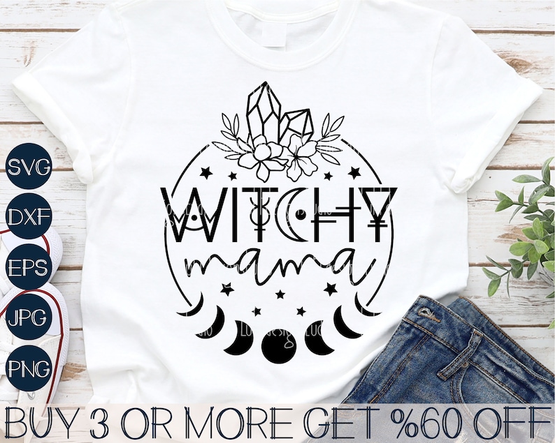 May include: A white t-shirt with a black circle design featuring the text "WITCHY mama" surrounded by stars, moons, and crystals.