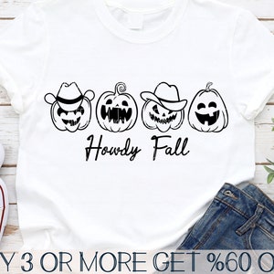May include: A white t-shirt with a black design of four pumpkins wearing cowboy hats. The pumpkins have different facial expressions. The text "Howdy Fall" is written below the pumpkins.