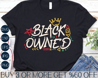 May include: Black t-shirt with a graphic design that says "Black Owned" in a colorful, stylized font. The design includes a crown, stars, and geometric shapes.