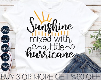 May include: A white t-shirt with a black and yellow graphic design that says "Sunshine mixed with a little hurricane".