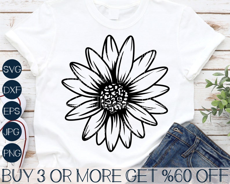 May include: Black and white graphic design of a daisy with a leopard print center. The design is on a white t-shirt. The text "BUY 3 OR MORE GET %60 OFF" is at the bottom of the image.