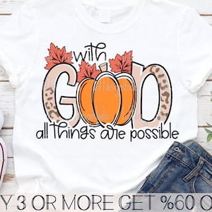 May include: White t-shirt with a pumpkin design and the text "with God all things are possible".
