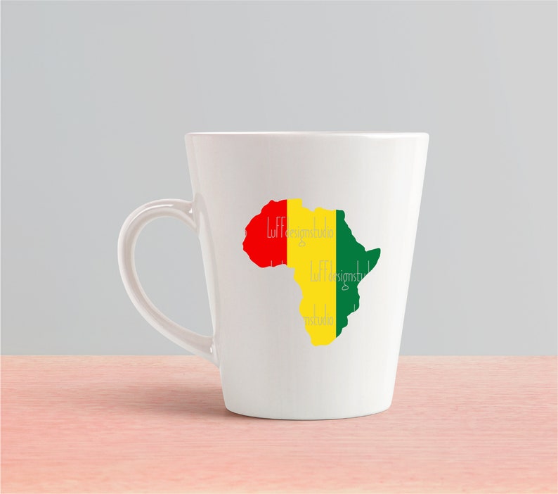May include: White ceramic mug with a green, yellow, and red outline of the continent of Africa. The text "Luff Designs" is written on the mug.