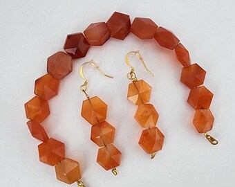 Orange carnelian faceted semi-precious stone bracelet and earring set with gold tone clasp and wire