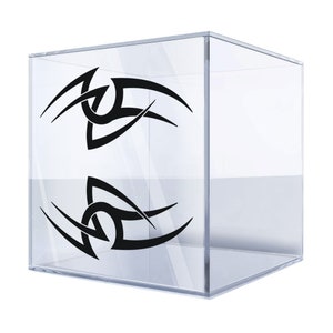 May include: Two black tribal-style designs on a clear acrylic cube.