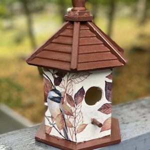 Birdhouse, Chickadee among the leaves