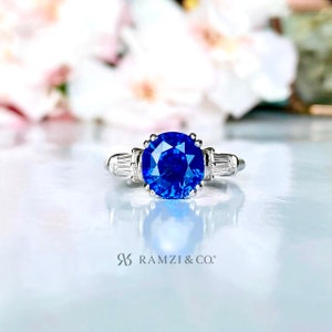 3.28ct Cornflower Blue Sapphire Ring | Slight Oval Cut | Certified | Baguette Diamond Accents | 18K White Gold Engagement Ring