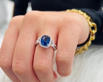 Royal Blue Sapphire Ring: Diamond Halo, 18K White Gold, Nature-Inspired