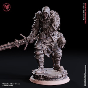 May include: A gray, detailed miniature figure of a hooded, armored warrior holding a sword and a severed head. The figure is standing on a circular base. The text "Wasteland Executioner (25 mm base)" is visible below the figure.