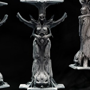 May include: A detailed, 125mm tall, grey, 3D printed sculpture of a Giger-inspired creature. The creature is a humanoid figure with a skeletal head and a body that resembles a tree. The sculpture is a tribute to the work of artist H.R. Giger.