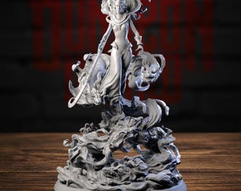 May include: A gray resin miniature figurine of a standing figure wearing a long gown and headpiece, holding a staff. The figure is surrounded by swirling smoke or cloud effects and small creature heads emerging from the base.