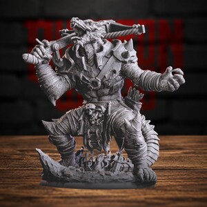 May include: A grey, unpainted miniature figurine of a reptilian humanoid warrior in a dynamic combat pose. The figure features scaled skin, armoured shoulder plates, and a crossbow held across its shoulders. It wears a loincloth with skull details.