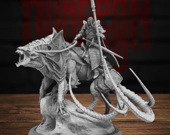 May include: A gray resin miniature figurine depicting a warrior in ornate plate armor riding a large, snarling reptilian beast. The warrior holds a long spear, while the creature features spiked armor plating and a long, segmented tail.