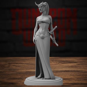 May include: A gray resin miniature figurine of a standing warrior wearing a horned mask, a strapless top, and a long skirt with a high slit. The figure holds a katana sword at the hip and stands on a circular base. The surface is matte gray.