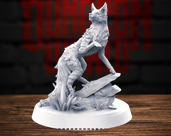 May include: A light grey miniature figurine of a wolf standing on a rocky base with small plant details. The wolf is depicted in a dynamic pose with one front paw raised, featuring textured fur details and pointed ears, mounted on a circular base.