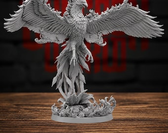 May include: A gray unpainted miniature figurine of a phoenix with wings fully spread, detailed feather textures, and a long flowing tail. The creature stands atop a base sculpted with swirling flame patterns, captured in a static, upright pose.