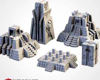 May include: A set of five grey miniature terrain structures featuring geometric designs, including two stepped pyramid buildings, a tall rectangular monolith, a square platform with small pillars, and a rectangular block with circular cutouts. Battle Builder tech logo.