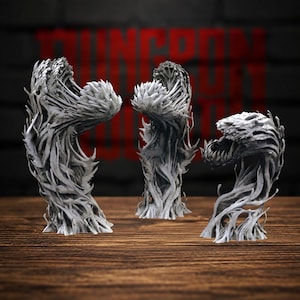 Puede incluir: Tres figuras en miniatura de color gris sin pintar que representan criaturas monstruosas parecidas a plantas con fauces dentadas y cuerpos texturizados similares a enredaderas. Cada figura se mantiene erguida con una forma orgánica.