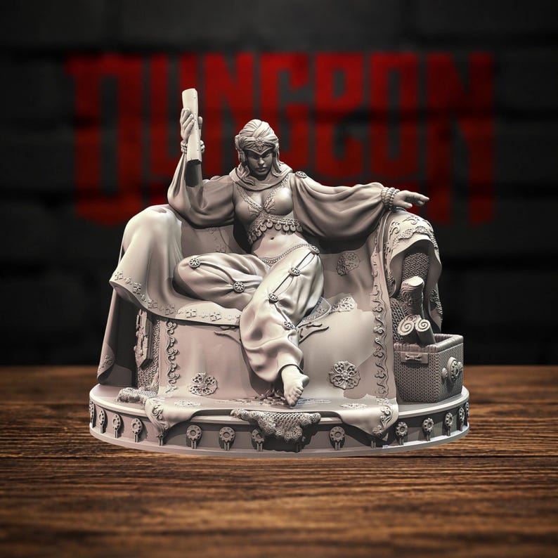 May include: A gray resin miniature figurine of a seated figure wearing a headpiece, a cropped top with dangling coins, and loose trousers. The figure holds a scroll in one hand while resting on an ornate, draped chair with a small chest nearby.