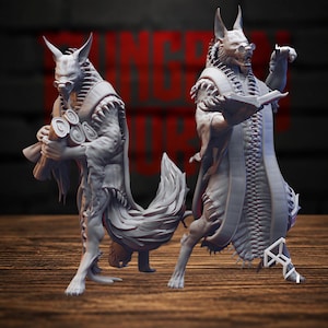 May include: Two grey, unpainted resin miniature figures depicting anthropomorphic wolf-like creatures wearing robes. One figure holds a bundle of scrolls, while the other holds an open book. Both figures feature pointed ears and round spectacles.