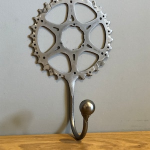 Cycle Helmet hanger, hat hook, coat hook, cyclist, welded cycle art, cycling gift, metal bike art.