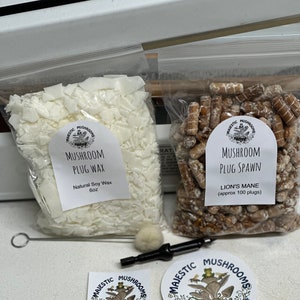May include: Two bags of mushroom growing supplies. One bag contains white soy wax plugs and the other bag contains brown mushroom spawn plugs. The bags are labeled "Mushroom Plug Wax" and "Mushroom Plug Spawn". The bags are labeled with the company name "Majestic Mushrooms".
