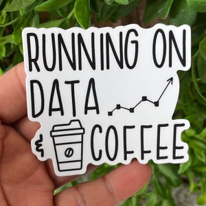 May include: White sticker with black text that reads "Running on Data & Coffee" with a line graph and a coffee cup icon.