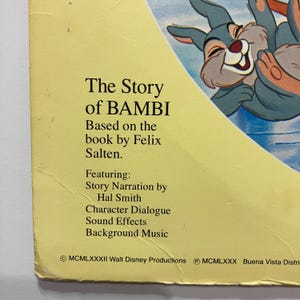 May include: A vintage book cover for "The Story of Bambi" by Felix Salten. The cover features the title in bold black text, with additional text listing the book's features. A cartoon illustration of a smiling rabbit is visible in the upper right corner.
