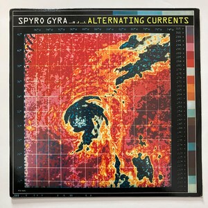 May include: A black vinyl record album cover with a red, orange, and yellow image of a weather map with the text "SPYRO GYRA... ALTERNATING CURRENTS" at the top.