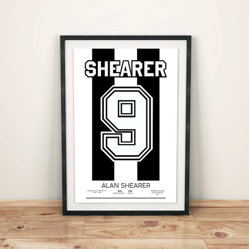 May include: Black and white poster with the name "Shearer" and the number "9" in a bold white font. The poster also includes the text "Alan Shearer", "Newcastle United F.C. 1996-2006", "405 Appearances", "206 Goals", and "Premier League Golden Boot (1995, 1996, 1997)".