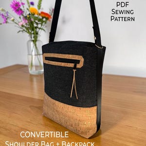 May include: A convertible shoulder bag and backpack featuring a black fabric upper section and a natural cork lower section. The bag includes a zippered pocket with a cork trim and a thin cord pull. Text on the image reads PDF SEWING PATTERN.