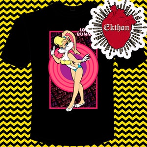 May include: Black t-shirt featuring a pink and white cartoon image of a rabbit wearing a swimsuit. The image is surrounded by a pink circle and the words "Love Bunny" are printed above the image. The words "Love" are repeated in a pattern around the image.