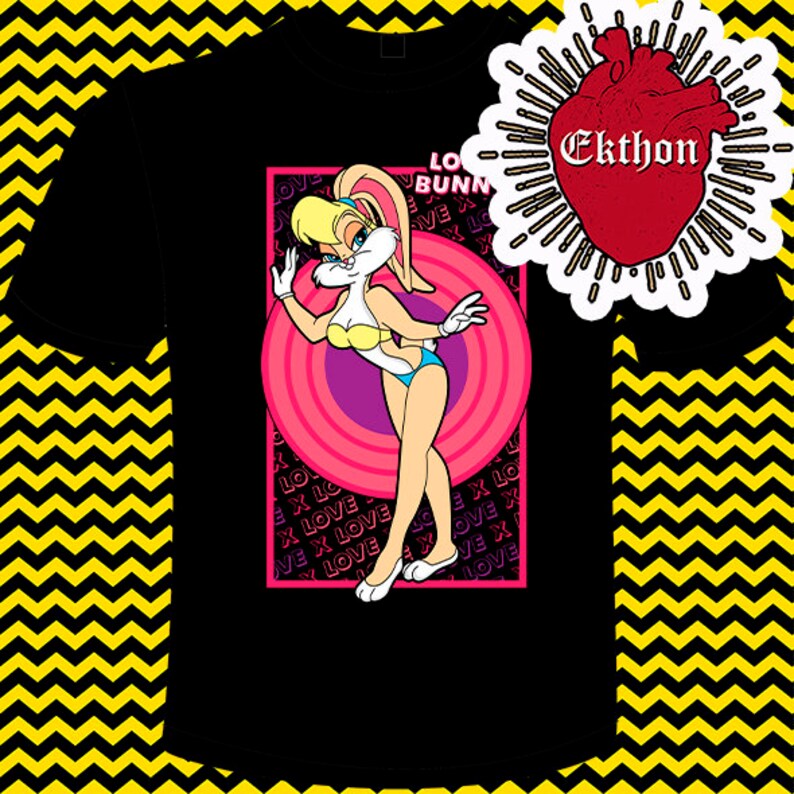 May include: Black t-shirt featuring a pink and white cartoon image of a rabbit wearing a swimsuit. The image is surrounded by a pink circle and the words "Love Bunny" are printed above the image. The words "Love" are repeated in a pattern around the image.