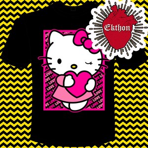 May include: Black t-shirt featuring a pink framed image of Hello Kitty holding a pink heart. The background is a yellow and black chevron pattern. The text "LOVE" is repeated in pink around the image. The text "Ekthon" is in white on a red heart.