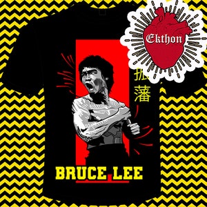 May include: Black t-shirt with a red and white graphic of Bruce Lee with the text "Bruce Lee" and "振藩" in Chinese characters. The graphic also includes a red heart with the text "Ekthon" in white.
