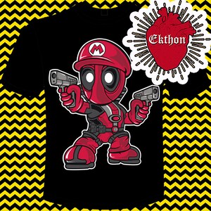 May include: A black t-shirt with a red and black cartoon character wearing a red and white hat with a white 'M' on it. The character is holding two guns and has a red heart with the word 'Ekthon' in white text above it.