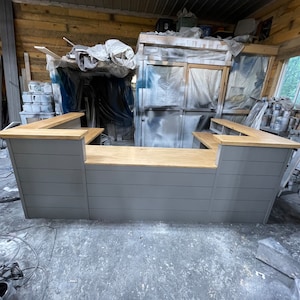 Rustic industrial reception desk with metal edging and slab 2nd tier
