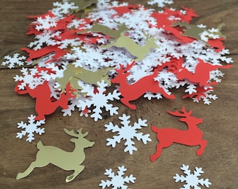 May include: A pile of red and gold reindeer and white snowflake confetti. The confetti is perfect for adding a festive touch to any Christmas party or celebration.