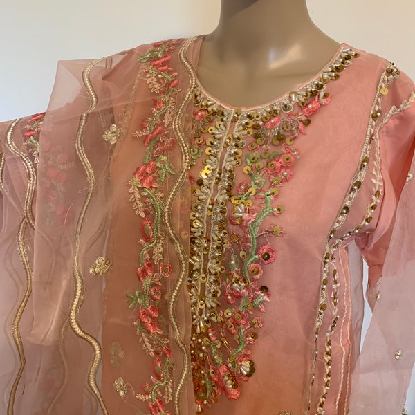 2 piece peach muslin Pakistani designer suit with pearl katdana sequins emb with matching dupatta.Stiched in Pakistan.36”38”40”42”44”anysize