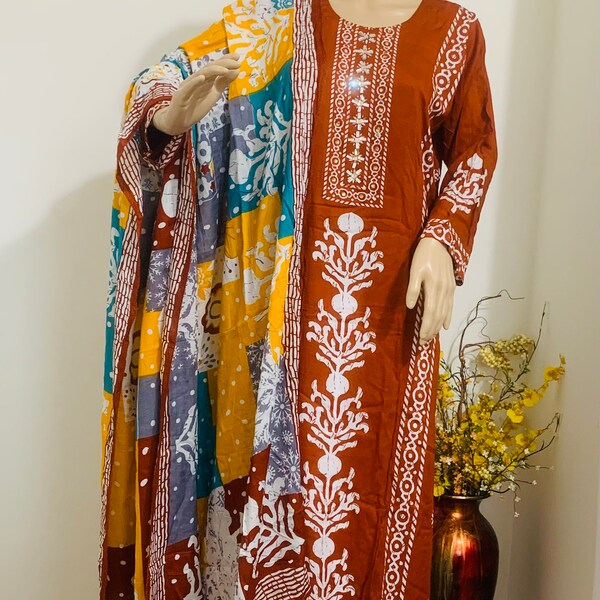 Brown color batik print 3pcs kurti has stone&foil work on neck.White pant with lace multi color printed soft cotton dupatta Size 42” 44”