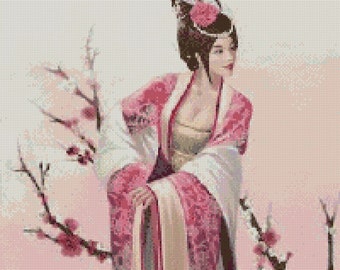 May include: A woman in a pink and white traditional Chinese dress stands in front of a pink and white flowering branch. She is wearing a white headpiece with a pink flower.