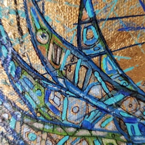 May include: Abstract artwork with a gold background and blue, green, and orange geometric shapes. The shapes have intricate details and are outlined in black. The artwork has a textured appearance and a close-up perspective.