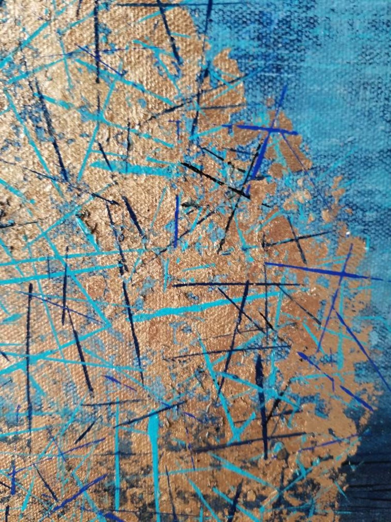 May include: Abstract painting with a textured canvas. The artwork features a gold-colored central area with blue and black lines and splashes. The background is a gradient of blue hues, creating a dynamic and textured visual effect.