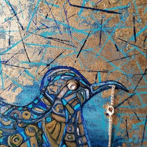 May include: Abstract painting of a bird with a gold and blue mosaic design. The bird holds a gold chain in its beak. The background features gold, blue, and black brushstrokes, creating a textured effect. The artwork has a modern, artistic style.