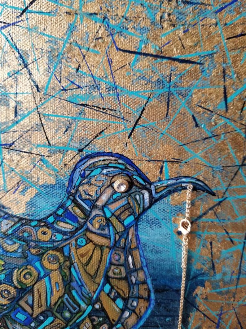 May include: Abstract painting of a bird with a gold and blue mosaic design. The bird holds a gold chain in its beak. The background features gold, blue, and black brushstrokes, creating a textured effect. The artwork has a modern, artistic style.